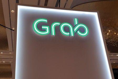 A Grab logo is pictured at the Money 20-20 Asia Fintech Trade Show in Singapore